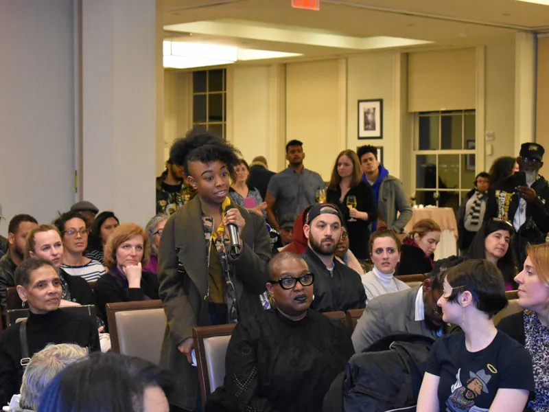 Audience Member Asking a Question