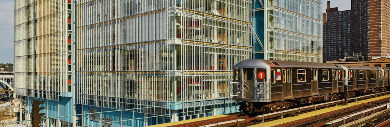 An elevated 1 train passes by Columbia's Manhattanville campus